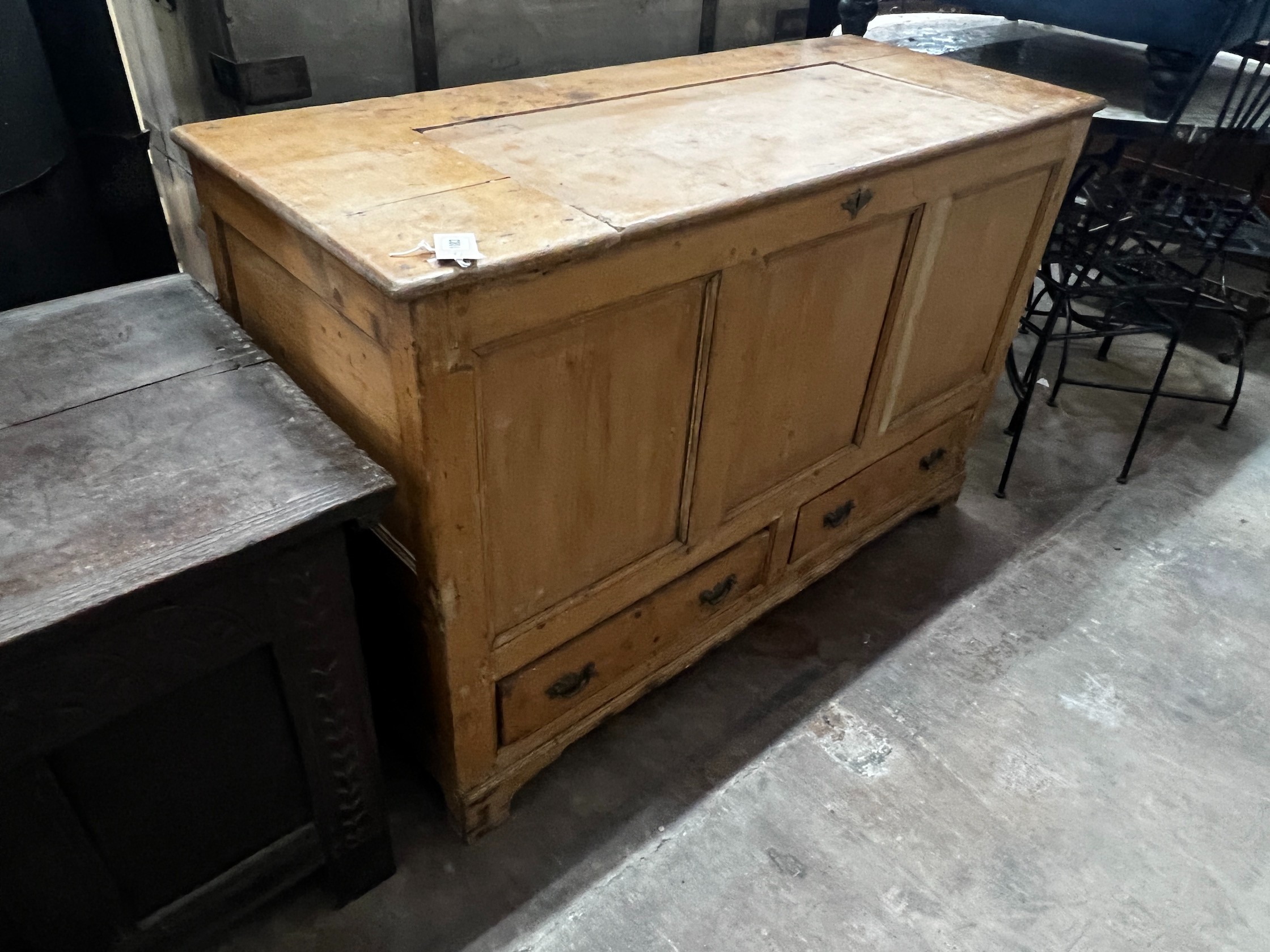 An early 19th century pine mule chest, the hinged top adapted, width 124cm depth 51cm height 80cm